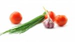 Mediterranean Food Ingredients: Spring Onions, Garlic And Tomato Stock Photo