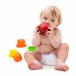 Cute Infant Boy With Apple Stock Photo