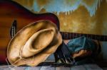 Hat And Guitar On Wooden Stock Photo