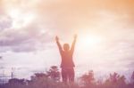 Relax Woman And Sunset Silhouette Stock Photo