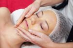 Woman Having Facial Mask At Beauty Salon Stock Photo