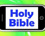 Holy Bible On Phone Shows Religious Book Stock Photo