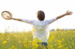 Beautiful Young Woman Enjoying Summer In A Field Stock Photo