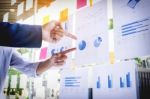 Businessman Making Presentation With His Colleagues And Business Stock Photo