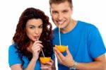 Couple Drinking Orange Juice Stock Photo