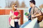 A Group Of Friends Talking In The Street After Class Stock Photo