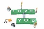 Miniature Worker Team Building Word Love You On White Background Stock Photo