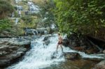 The Man Standing At Mae Ya Waterwall Stock Photo