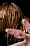 Portrait Of Young Female Hiding Her Face With Hair Stock Photo