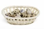 Raw Quail Eggs Inside A Wicker Basket Stock Photo