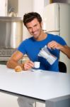 Man Pouring Coffee Stock Photo