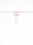 Pink Paperclip Attached On White Paper Isolated Stock Photo