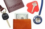 Car Key, House Key, Passport And Stethoscope With Money In Wallet Stock Photo