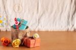 Gift And Roses On A Wooden Floor Stock Photo