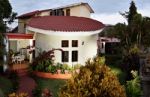 House With Balcony And Garden Stock Photo