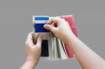 Hands Pull Credit Or Debit Card Out Of Wallet Stock Photo