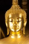 Golden Buddhist Statue Face Stock Photo