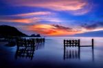 Seascape With Row Of Wood At Sunset Stock Photo