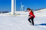 Young Woman Is A Happiness With Camera In Winter Of Sky And Winter Road With Snow And Red Dress Stock Photo