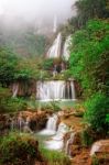 Waterfall In Tropical Forest Stock Photo