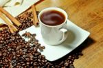 Hot Coffee With Beans And Herbal Stock Photo