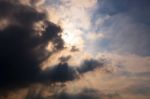 Sun Behind Clouds Background Stock Photo