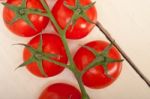 Fresh Cherry Tomatoes On A Cluster Stock Photo