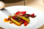 Fried Chili Pepper And Vegetable On A Wok Pan Stock Photo