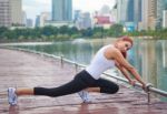 Young Woman Doing Stretching Exercise Stock Photo