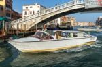 Motorboat Cruising Down The Grand Canal In Venice Stock Photo