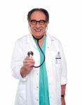 Senior Doctor Holding stethoscope Stock Photo