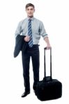 Young Businessman Posing With Trolley Bag Stock Photo