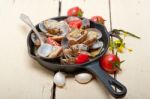 Fresh Clams On An Iron Skillet Stock Photo