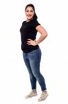 Full Length Of Young Woman Posing Stock Photo