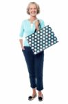 Charming Senior Lady With Shopping Bag Stock Photo