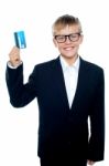 Young Boy Holding Credit Card Stock Photo