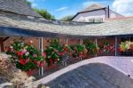 A Row Of Hanging Baskets Stock Photo