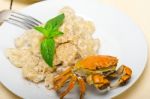 Italian Gnocchi With Seafood Sauce With Crab And Basil Stock Photo