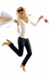 Side View Of Pleased Female Holding Carry Bags Stock Photo