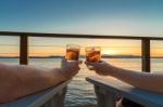 Romantic Evening Cocktails On Seaside Deck Stock Photo