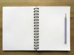 White Paper Note Book With Grey Pencil On Wood Background Top Vi Stock Photo