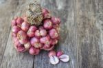 Shallot Onions In A Group On Wood Stock Photo