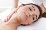 Woman Enjoying Shoulder Massage At Beauty Spa Stock Photo