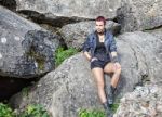 Punk Girl Sitting On A Stone Stock Photo