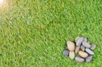 Stone On Grass Background Stock Photo