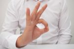 Business Man Giving Okay Sign Stock Photo