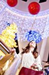 Beautiful Young Woman Holding Shopping Bags Stock Photo