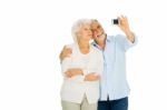 Elderly Couple With Camera Stock Photo