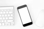 Phone Blank Screen On White Work Table Stock Photo