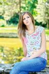 Woman On Sunny Day In Park Stock Photo